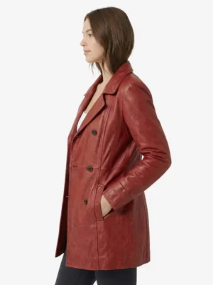 Side profile of the Cassandra Webb red coat showing the sleeve length, hand pockets, and premium leather texture